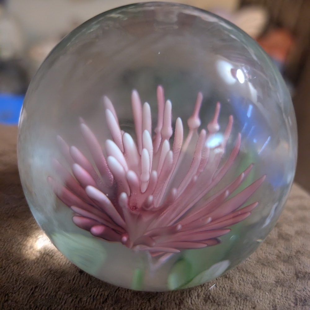 A vintage pink clover paperweight.